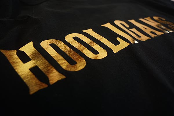 Gold foil print on black shirt